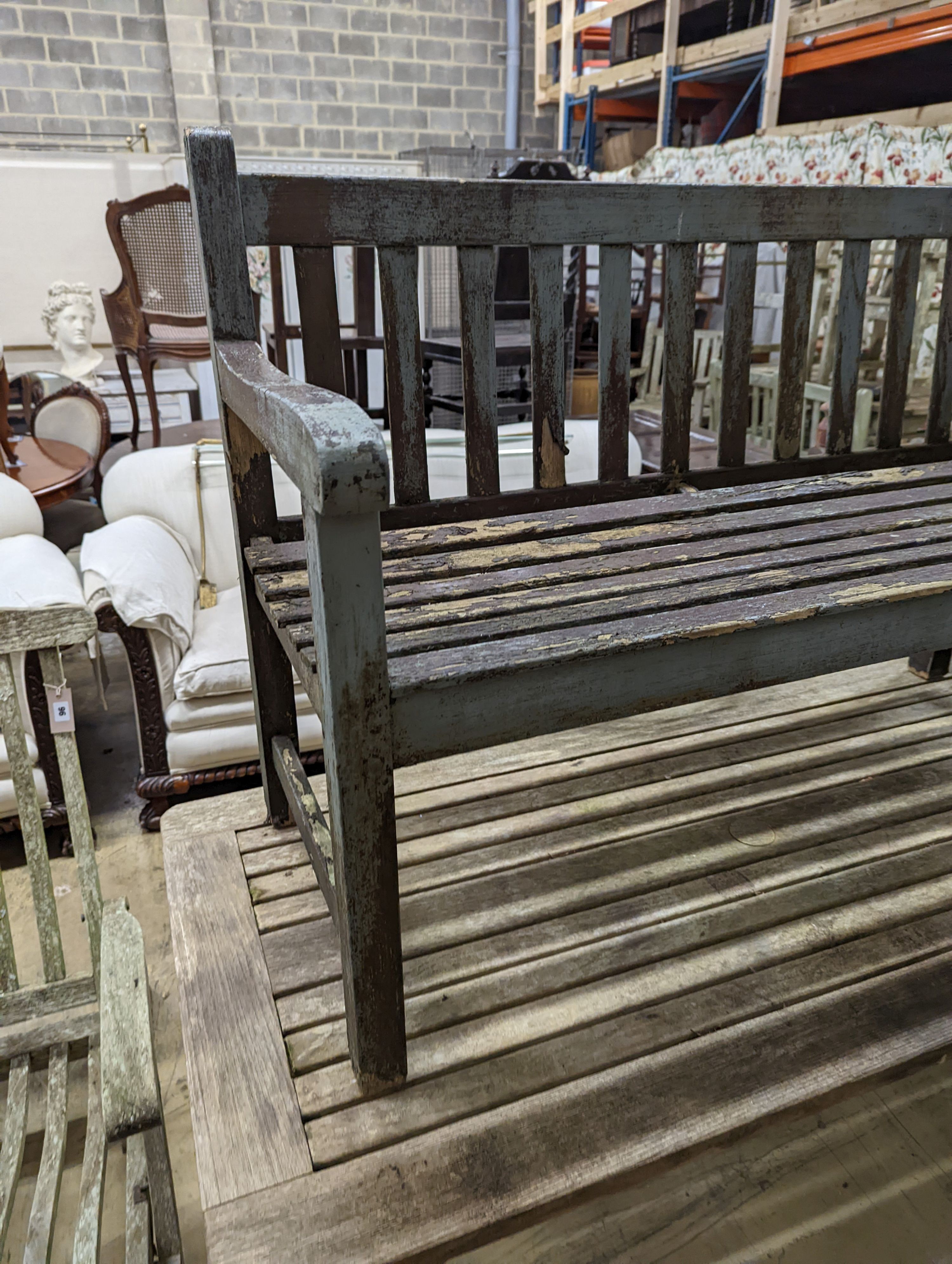 A weathered teak garden bench and rectangular table. Bench - W-122cm, D-54cm, H-83cm. Table - W-149cm, D-70cm, H-74cm.